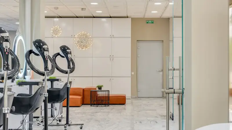 Bright salon with styling chairs and a glass front