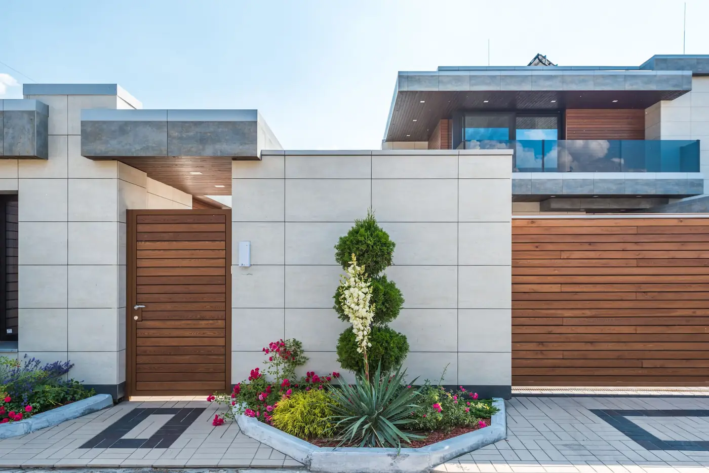 Neat front garden with topiary outside a modern house